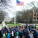 Runners gather on the University of Michigan diag while an American flag flies at half-mast before the run in honor of the Boston Marathon on Saturday, April 20. AnnArbor.com I Daniel Brenner